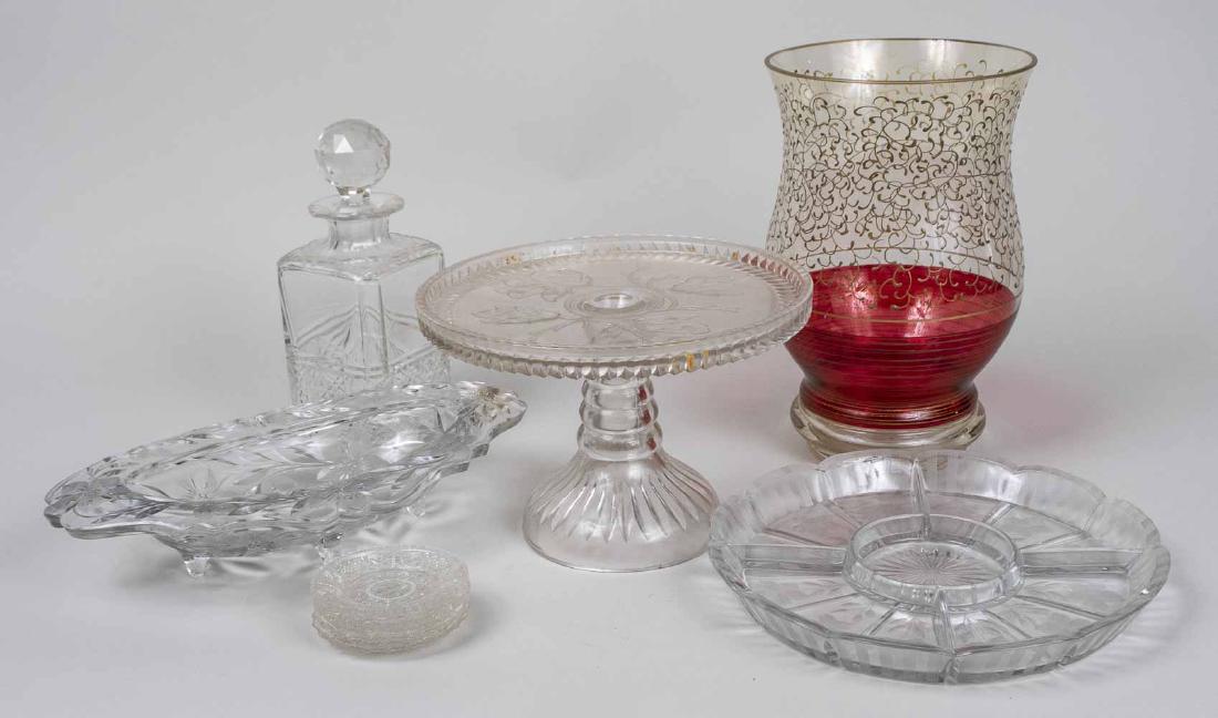 Group of Glass Table Decorations: Including a spirit decanter, a relish dish, a cake stand, a circular divided dish, vase, etc. Tallest, height 10 3/4 inches. Notice to bidders: Condition reports and additional photographs are provide