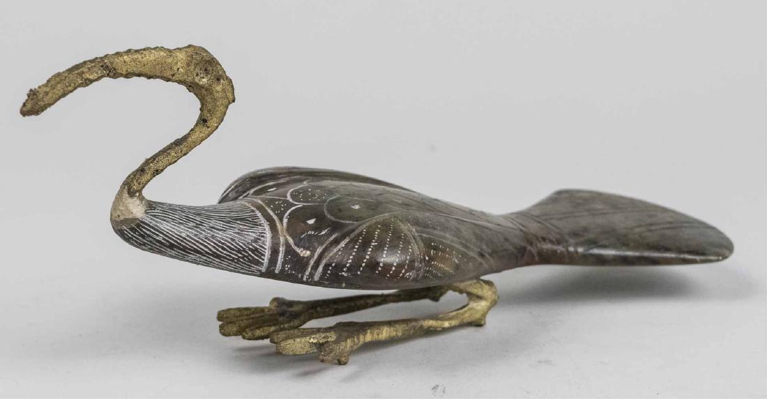 Metal Mounted Carved Stone Figure of a Bird: Modeled squatting, incised feather decoration. Height 4 inches, length 10 inches. Notice to bidders: Condition reports and additional photographs are provided by request as a courtesy to our clients, 