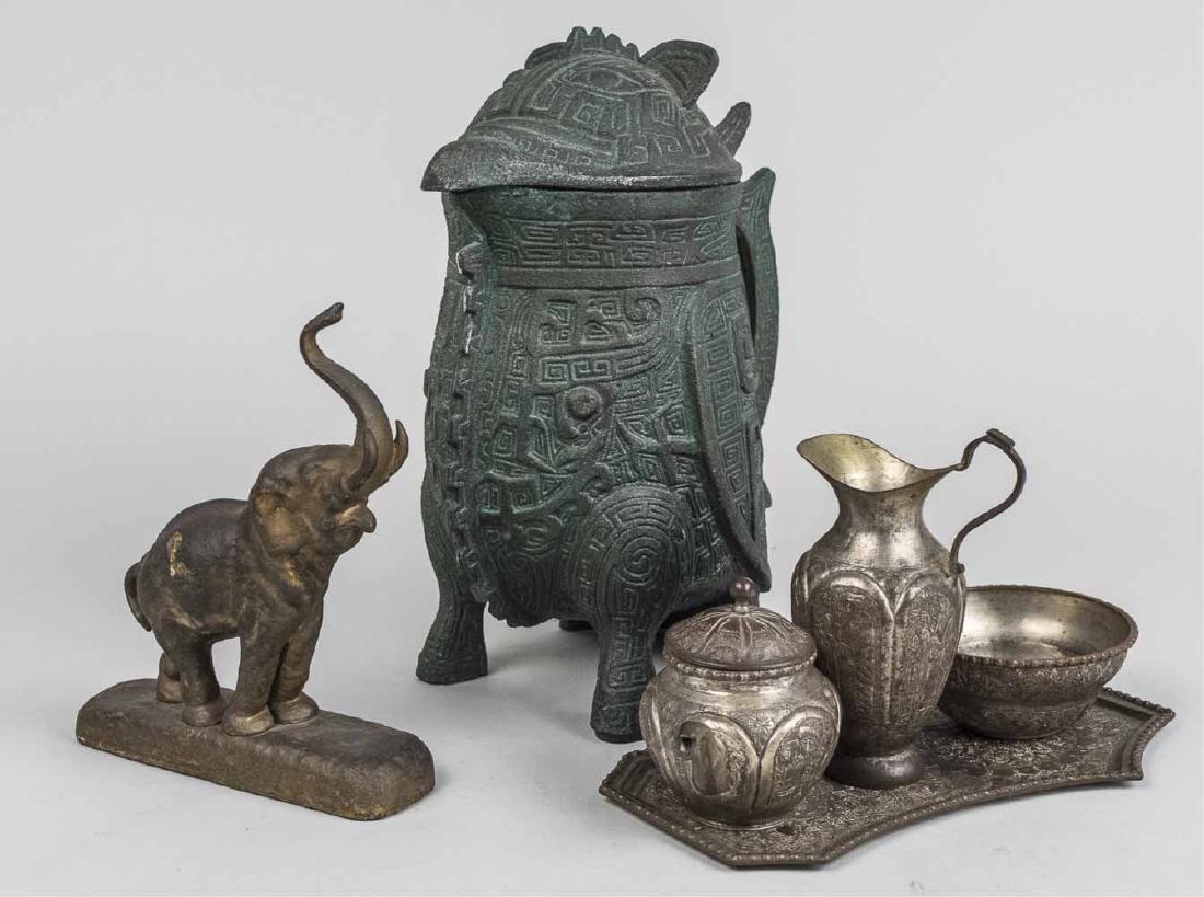 Group of Metal Table Decorations: Including a figure of an elephant, a cream and sugar set with tray, zoomorphic pitcher, etc. Elephant, height 6 inches. Notice to bidders: Condition reports and additional photographs are provided by 