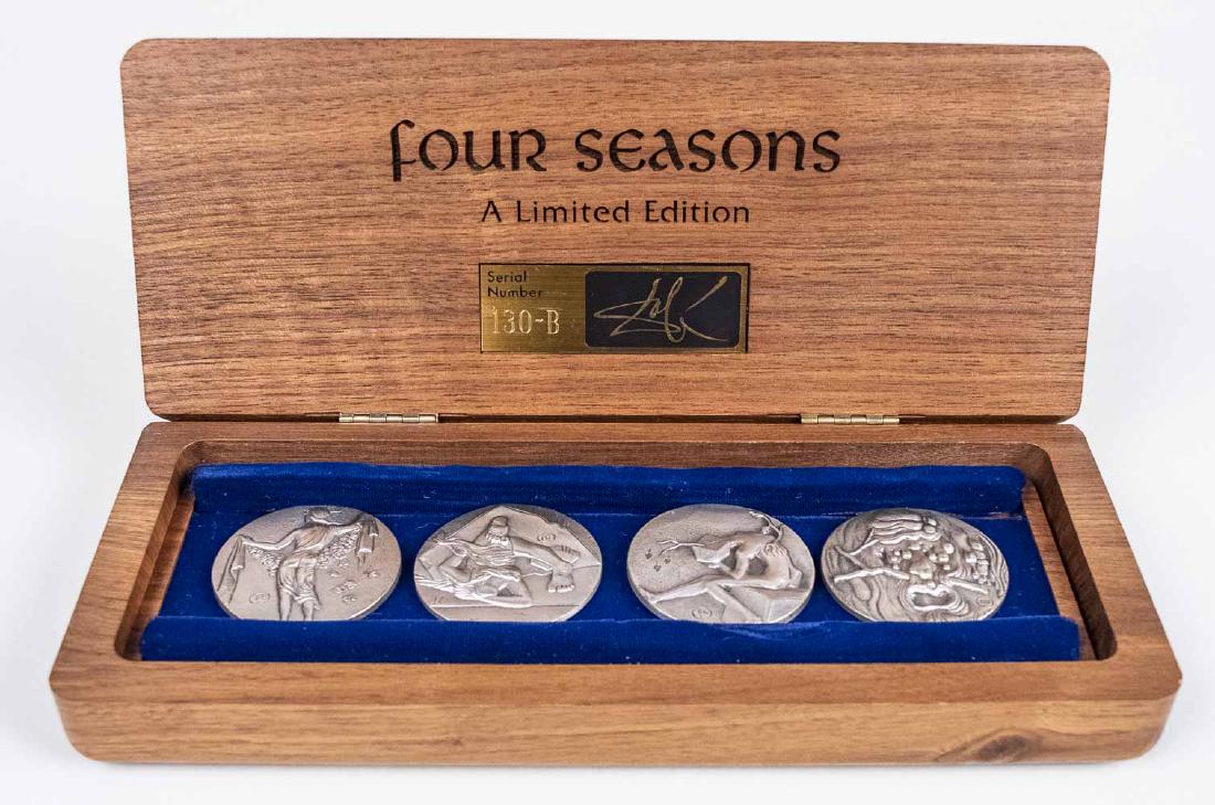 Salvador Dali Silver Four Seasons Medallion Set: 1979, number 130-B from the edition of 1,000, each decorated in relief and inscribed with signature on both sides and numbered, with Certificate of Authenticity and original walnut presentation case,