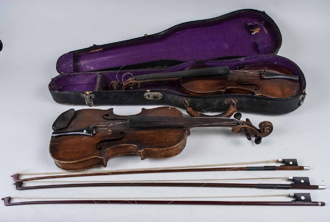 Two Violins and Three Bows: Both with one part back, both 14 1/2 inch back and three bows, one with mother of pearl frog, another signed Glasser and another bow, one carrying case. Notice to bidders: Condition reports and additi