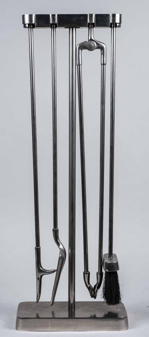 Chrome Fireplace Tool Set: Brush, poker, tongs, shovel and stand; together with a matching log carrier. Height 31 inches. Notice to bidders: Condition reports and additional photographs are provided by request as a courtesy to 