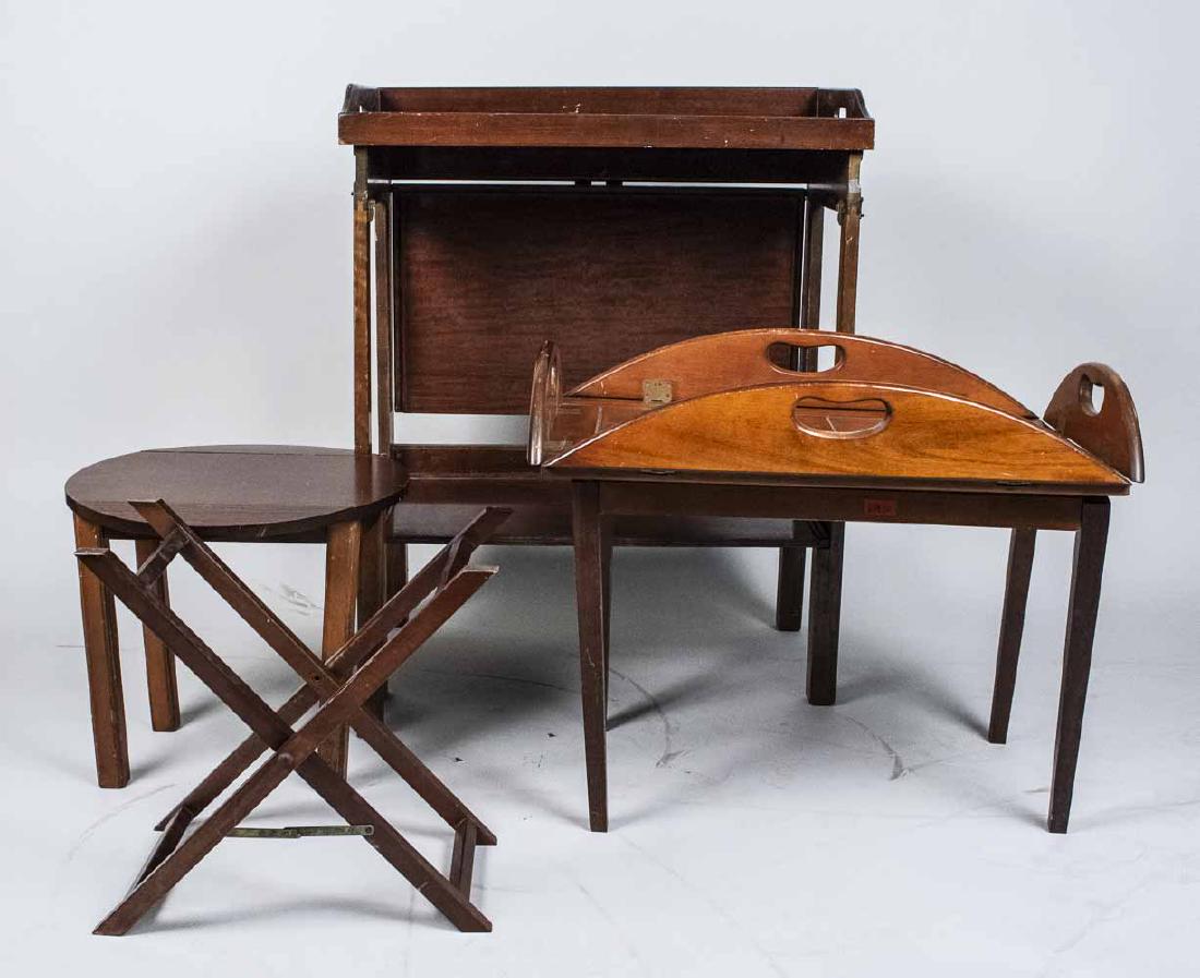 Two Wood Tray Tables and a Fold Top Table: Butlers tray table, a rectangular tray, a folding shelf unit and a small drop leaf table. Shelf, height 34 inches, width 29 inches, depth15 1/2 inches. Provenance: From the Estate of Robert Sauers of 