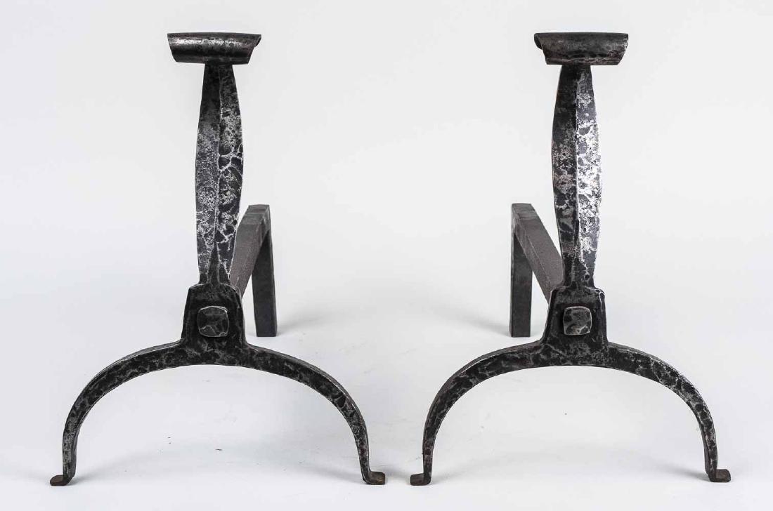 Pair of Hammered Wrought Iron Andirons: Scroll decoration. Height 12 1/2 inches. Notice to bidders: Condition reports and additional photographs are provided by request as a courtesy to our clients, as such any condition report is only an o