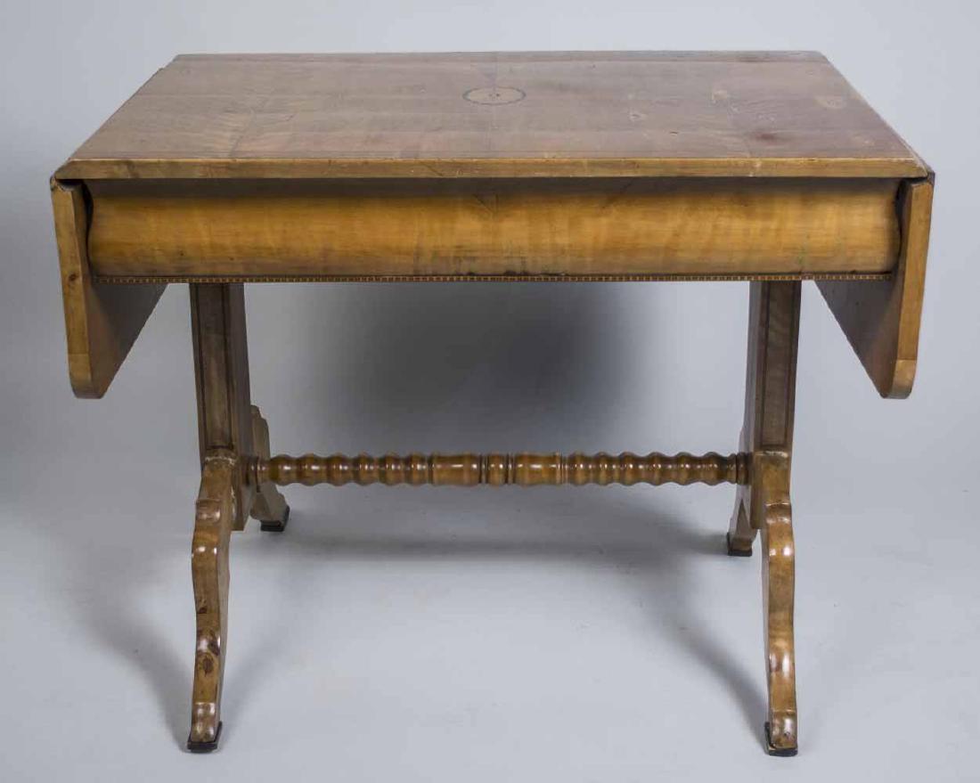 Continental Inlaid Sofa Table: Rectangular top with inlaid patera, flanked by side drop leaves, over an ogee molded drawer, trestle base. Unextended, height 31 inches, width 37 inches, depth 26 inches. Notice to bidders: Condition 