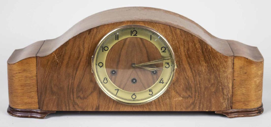 German Art Deco Mantle Clock: Brass chapter ring with Arabic numerals, movement with three quarter striking. Height 9 inches. Notice to bidders: Condition reports and additional photographs are provided by request as a courtesy to