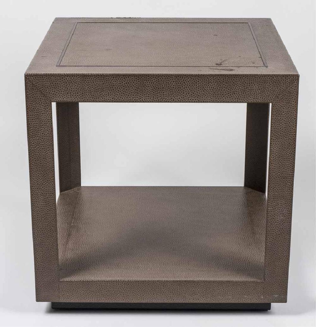 Leather Clad End Table: Square top on block legs joined by a lower shelf. Height 24 inches, 24 inches square. Notice to bidders: Condition reports and additional photographs are provided by request as a courtesy to our clien