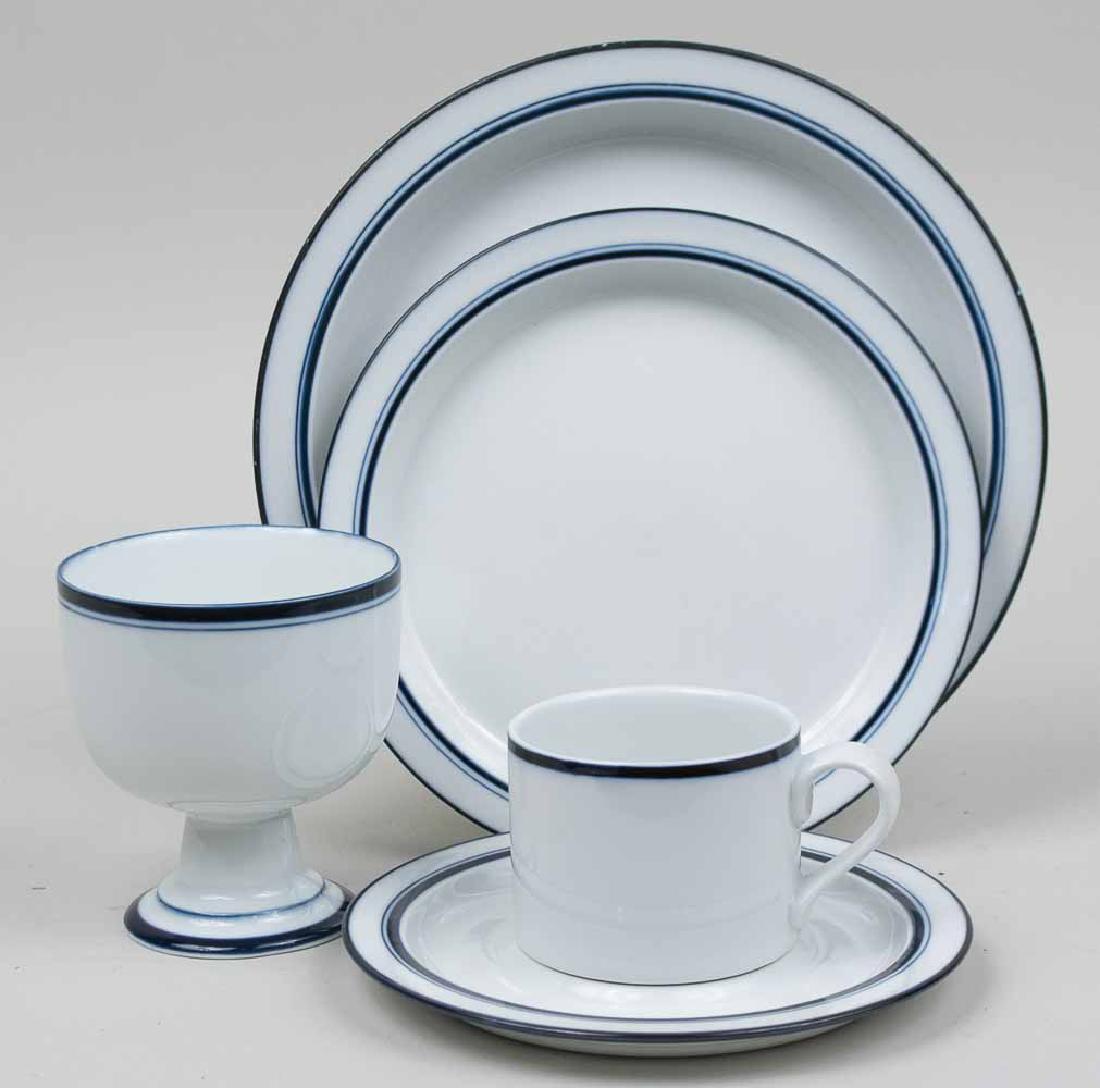 Dansk Bistro Porcelain Dinner Service: Approximately forty five pieces, comprising nine dinner plates, seven salad plates, seven pedestal bowls, eleven cups, and twelve saucers. Dinner plate, diameter 10 3/8 inches. Notice to bidders: Cond