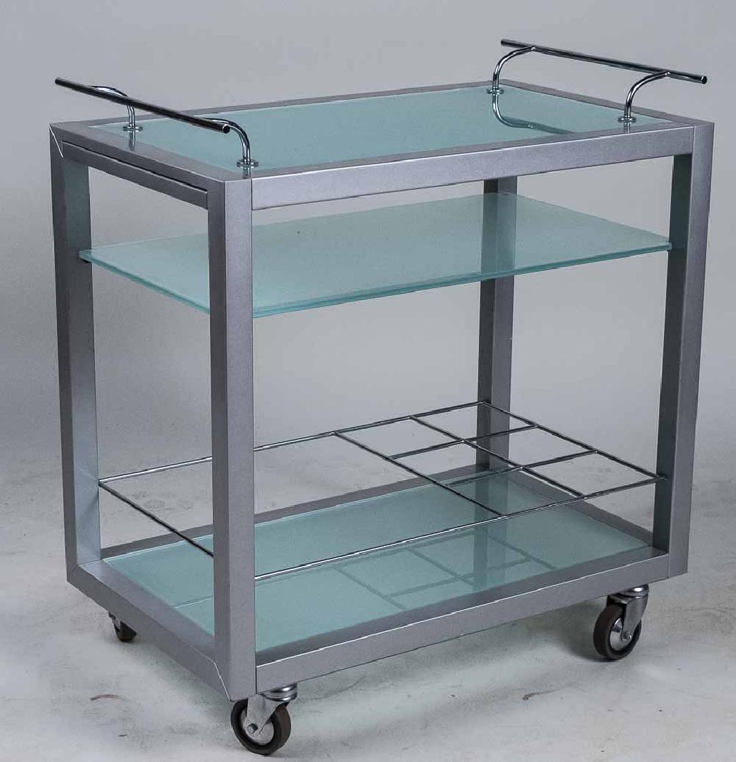 Metal Tea Cart: Frosted glass removable tray top over two frosted glass lower shelves, on wheels. Height 28 inches, width 28 inches, depth 17 inches. Notice to bidders: Condition reports and additional photographs ar