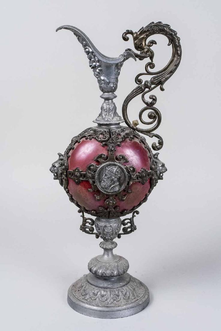 Metal Ewer: Renaissance style patinated ewer with scroll decoration. Height 18 1/2 inches. Notice to bidders: Condition reports and additional photographs are provided by request as a courtesy to our clients, as 