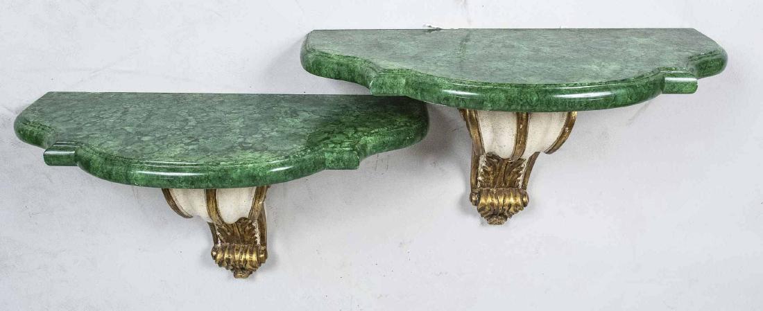 Pair of Painted Brackets: Faux malachite painted tops on parcel gilt and cream painted brackets. Height 16 inches, width 30 inches, depth 14 inches. Notice to bidders: Condition reports and additional photographs are provided