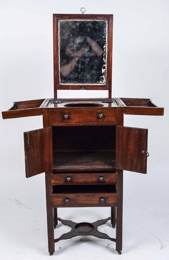Victorian Mahogany Harlequin Wash Stand: Split rectangular top opening to a fitted interior with lift up mirror, all above a false front drawer, a two door cabinet and two drawers, on square block legs joined by a shaped X stretcher. Open, h