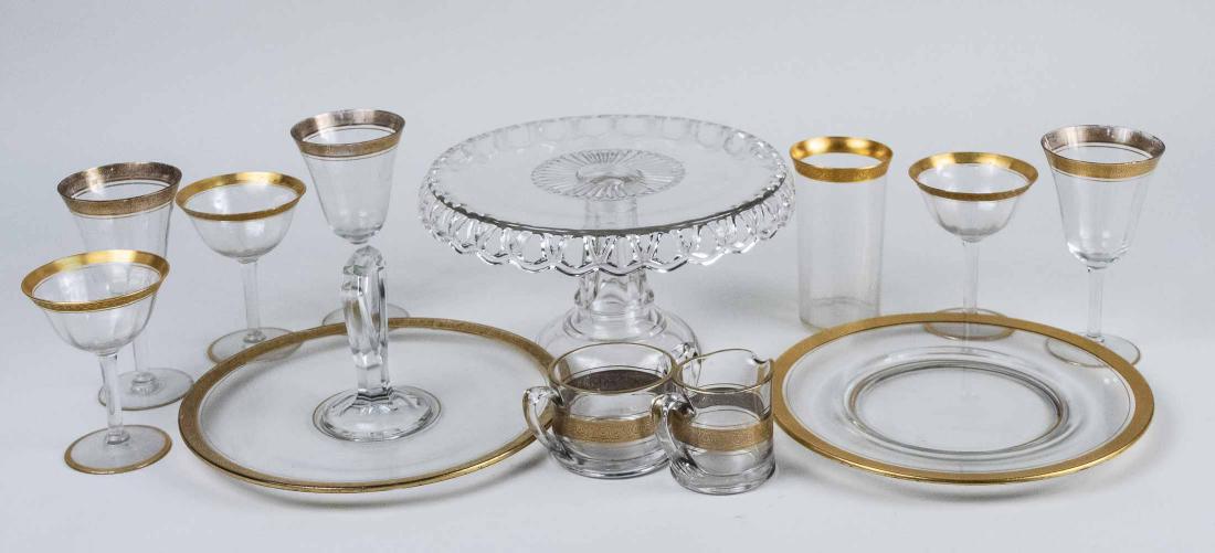 Assembled Gold Trim Glassware: Including stemware, cake stand, cake plate, cream and sugar set, etc. Notice to bidders: Condition reports and additional photographs are provided by request as a courtesy to our clients, as such any