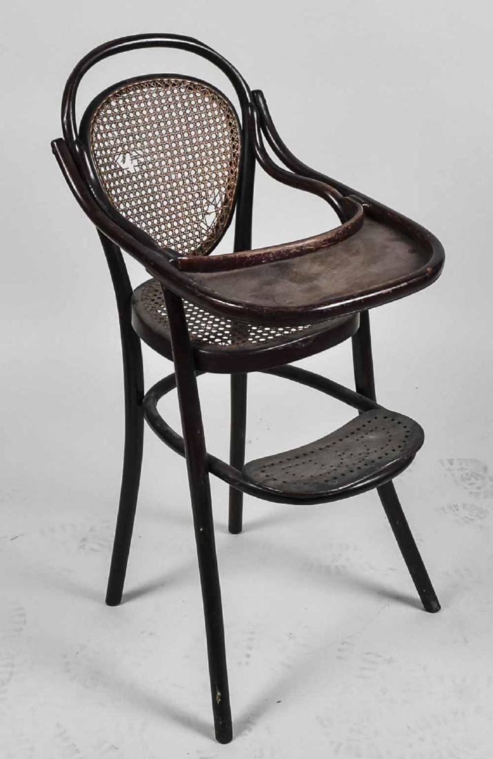 Caned Feeding Chair: Height 38 inches, width 16 inches, depth 26 inches. Notice to bidders: Condition reports and additional photographs are provided by request as a courtesy to our clients, as such any condition report i