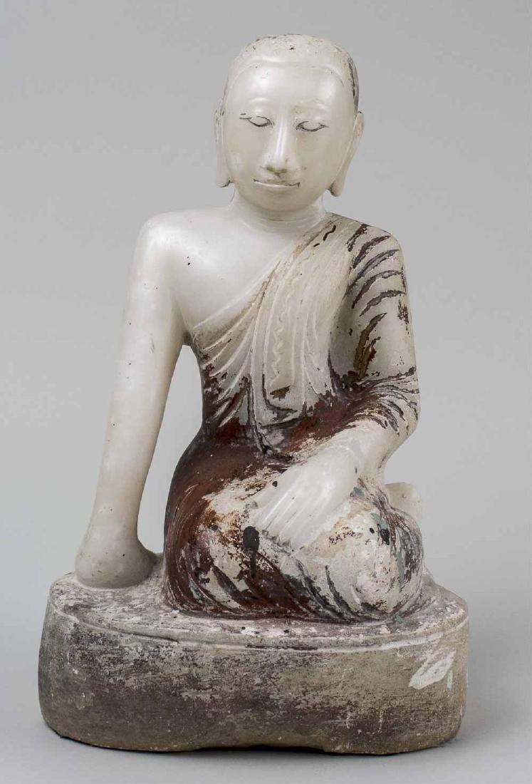 Alabaster Buddha: Carved in seated position, resting on his right arm, remnants of old paint. Height 15 inches. Notice to bidders: Condition reports and additional photographs are provided by request as a courtesy to o