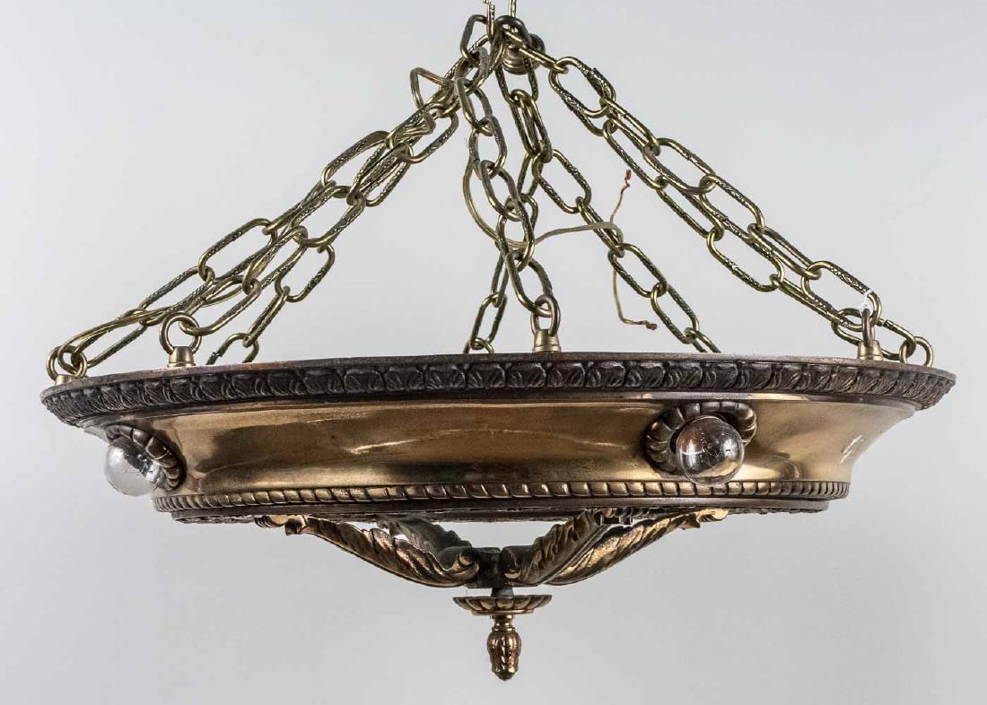 Pair of Art Deco Style Hanging Light Fixtures: Circular frame with glass inset panel at the bottom. Height 10 inches, diameter 22 inches. Notice to bidders: Condition reports and additional photographs are provided by request as a courtesy to our 