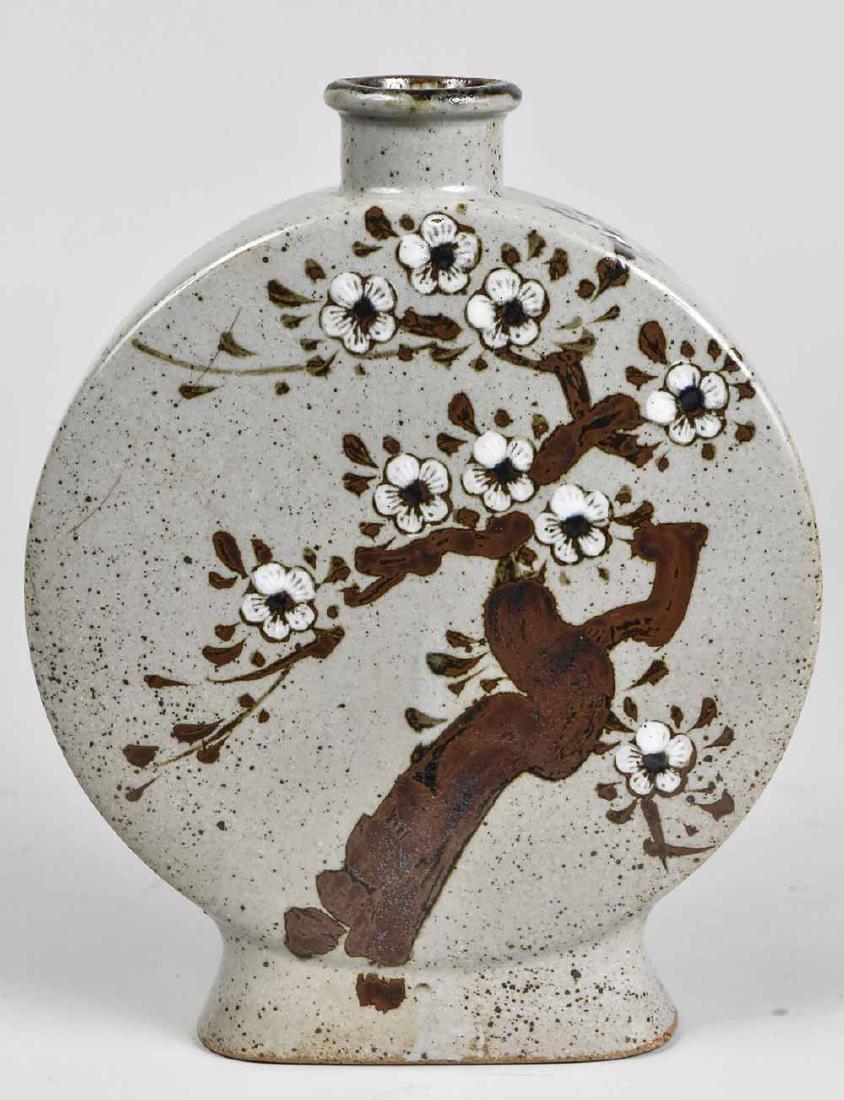 Korean Moon Vase: Circa 1930, floral decoration. Height 10 1/2 inches. Notice to bidders: Condition reports and additional photographs are provided by request as a courtesy to our clients, as such any condition report 