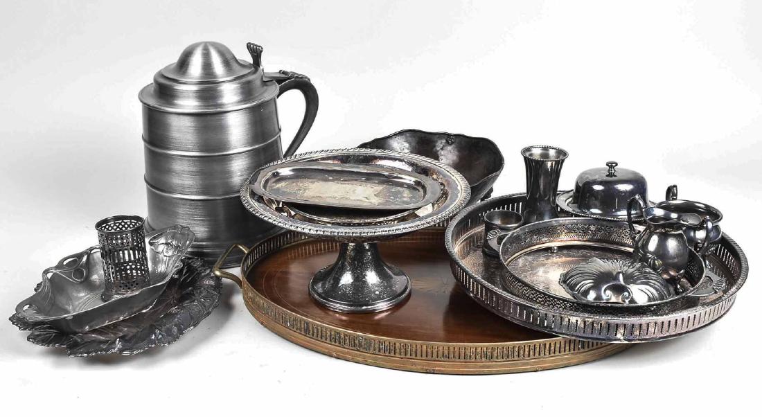 Group of Silver Plated Tables Articles: Including a tankard, two trays with gallery, compote, butter dish, bowls, etc. Largest tray, length 15 inches. Notice to bidders: Condition reports and additional photographs are provided by request a