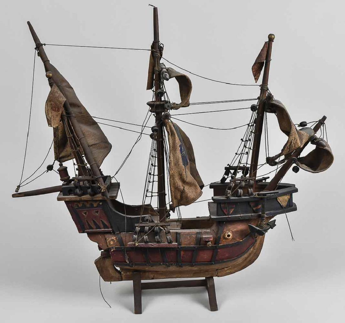 Model Sailing Ship: Wood model with three masts. Height 21 inches. Notice to bidders: Condition reports and additional photographs are provided by request as a courtesy to our clients, as such any condition report is onl