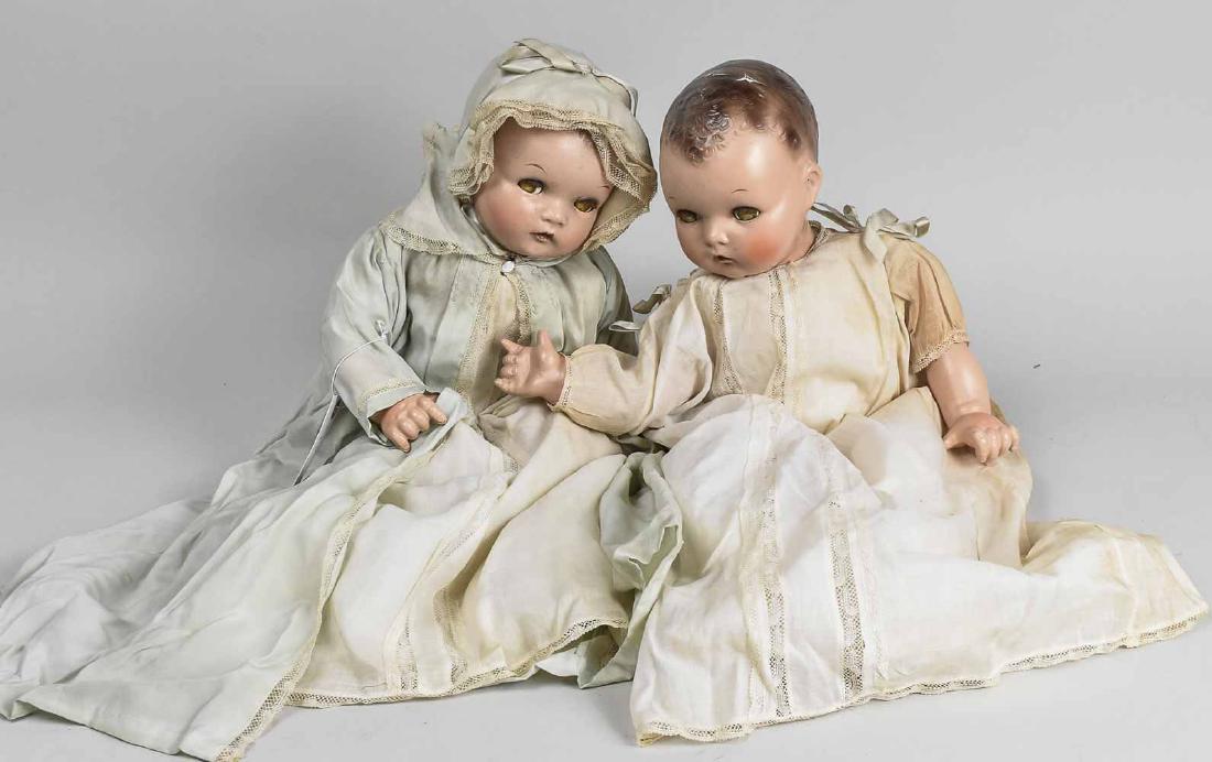 Two Ideal Composition Baby Dolls: In linen christening gowns, one with bonnet, each with sleepy eyes, jointed body, (loose stringing)molded bown hair, necks impressed. Taller, height 21 inches. Notice to bidders: Condition reports and
