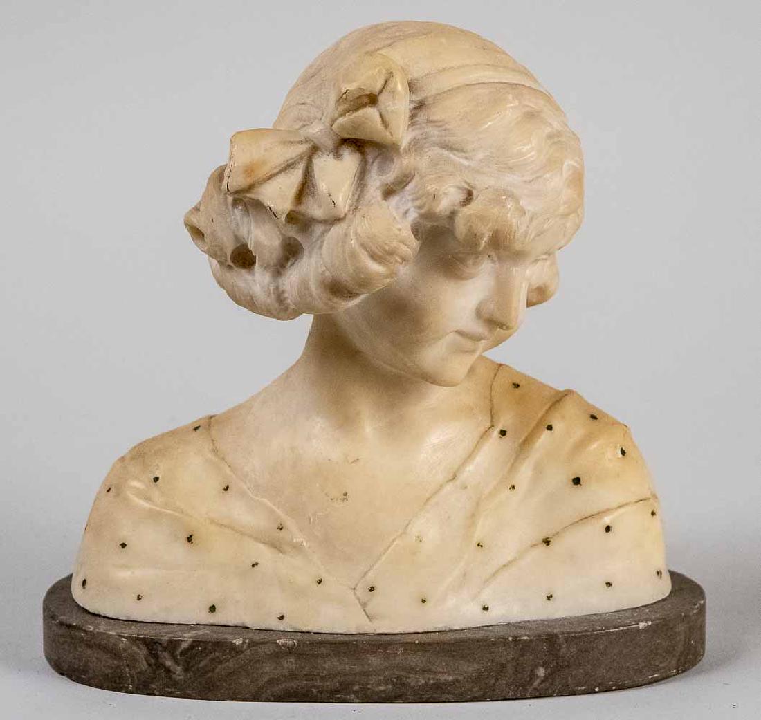 Alabaster Bust of a Young Girl: Modeled facing to her left, a bow in her hair. Height 9 inches. Notice to bidders: Condition reports and additional photographs are provided by request as a courtesy to our clients, as such any condit