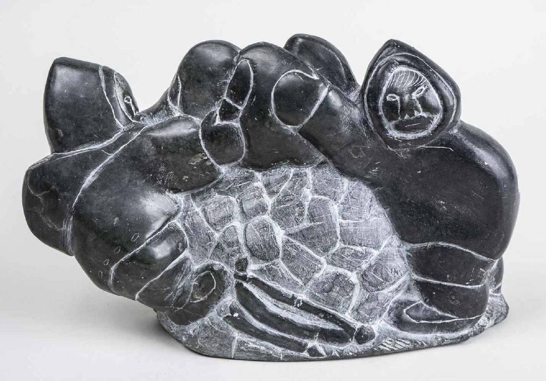 Inuit Carved Stone Sculpture: Two figures with animal . Illegible markings on base. Height, 7 1/2 inches. Length, 11 inches. Notice to bidders: Condition reports and additional photographs are provided by request as a courtesy to 
