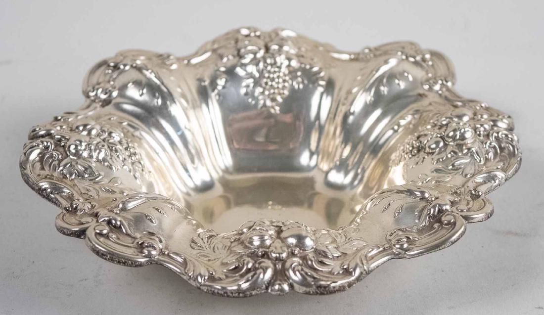 Reed and Barton Sterling Silver Dish: Francis I pattern. Height 1 3/4 inches, diameter 8 inches, 308 grams. Notice to bidders: Condition reports and additional photographs are provided by request as a courtesy to our clients, as such any