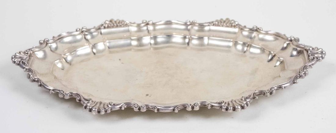 Dominick & Haff Sterling Silver Oval Tray: Oblong tray with scroll border, dated 1898. Length 15 inches, 908 grams. Notice to bidders: Condition reports and additional photographs are provided by request as a courtesy to our clients, as such a
