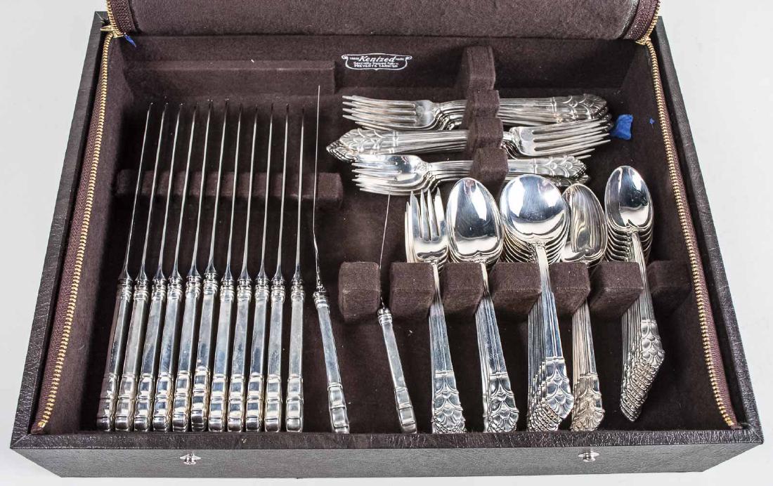 Tiffany & Co Sterling Silver Flatware Service: Palmette pattern, comprising eleven dinner knives, eleven dinner forks, eleven salad forks, eleven tablespoons, eleven cream soup spoons, eleven teaspoons. Total 3810 grams, weighable. Notice to bidde
