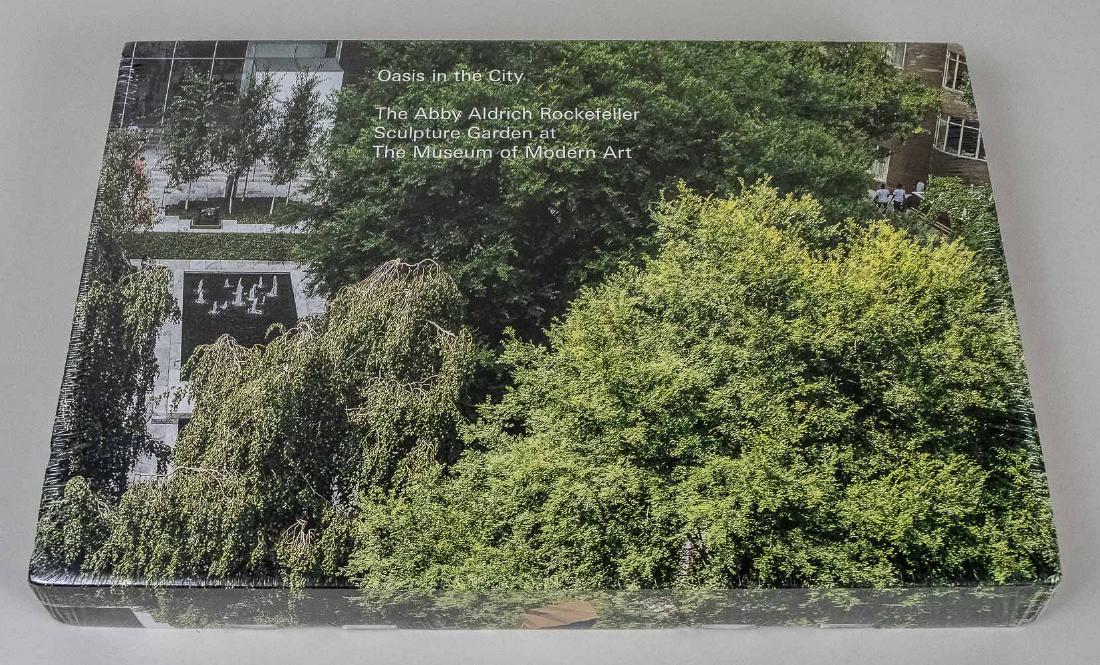 Coffee Table Book of MOMA Sculpture Garden: Oasis in the City, the Abby Aldrich Rockefelller Sculpture Garden at the Museum of Modern Art, in original packaging and box. Box 181/8 inches x 12 inches, book 16 inches x 11 1/4 inches. Notice to bi