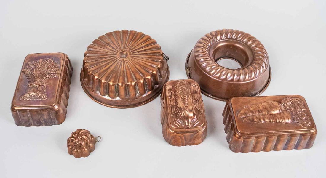 Six Copper Molds: Includes a set of three rectangular molds, one decorated with wheat sheaf, another carrors and another an ear of corn, together with two bundt pan molds and a small swirl top mold. Bundt molds, diamet