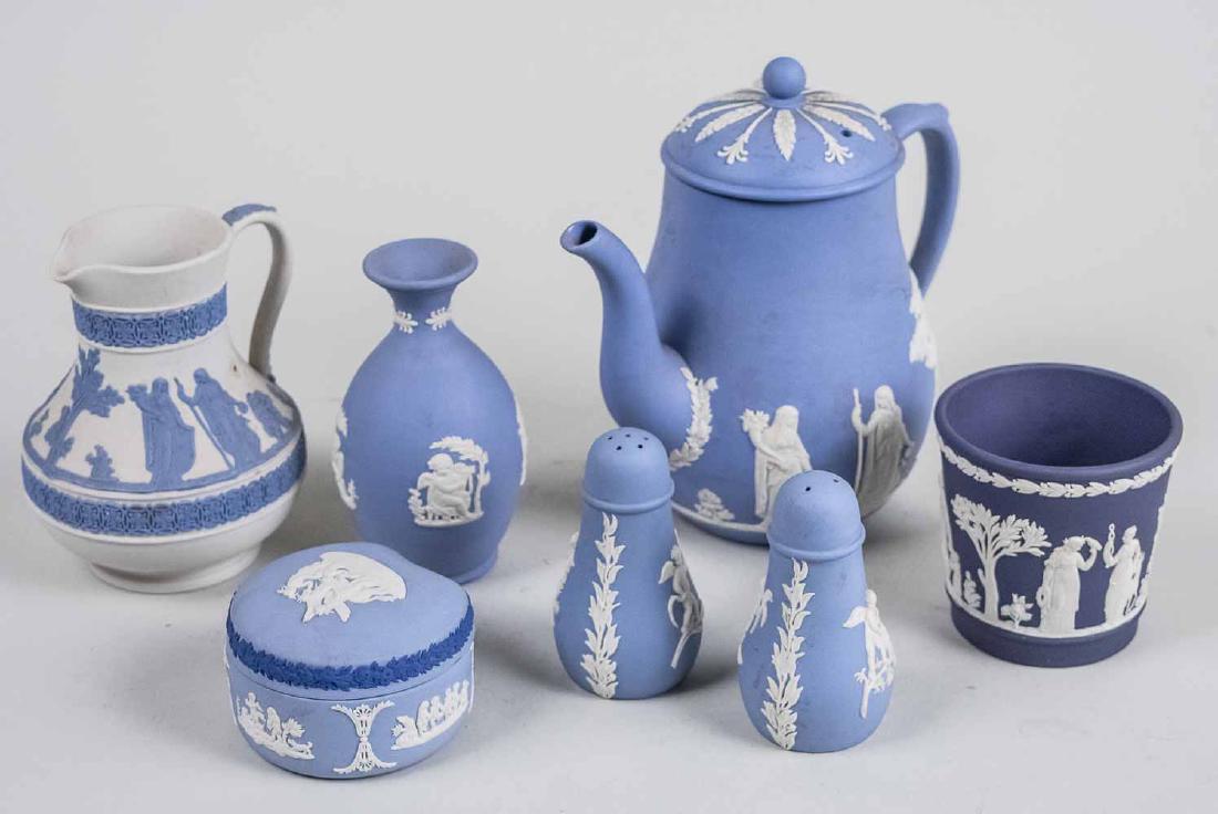 Group of Wedgwood Table Articles: Comprising a teapot, creamer, pair of shakers, bud vase, cachepot, and covered box. Teapot, height 6 3/4 inches. Notice to bidders: Condition reports and additional photographs are provided by request
