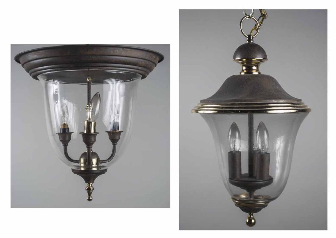 Two Contemporary Bell Jar Lanterns: One a flush mount fixture, each with clear glass shade, rust colored patina and brass accents. Flush mount fixture, height 16 inches, diameter 16 inches; hanging lantern, height 20 inches, diameter 12