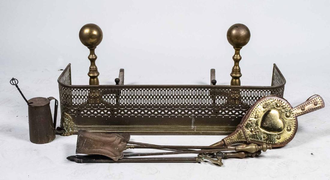 Brass Fireplace Fender, Andirons & Tools: Including a pair of canon ball top andirons, a pierced brass fire fender, bellows, set of tools etc. Andirons, height 18 inches. Notice to bidders: Condition reports and additional photographs are pro