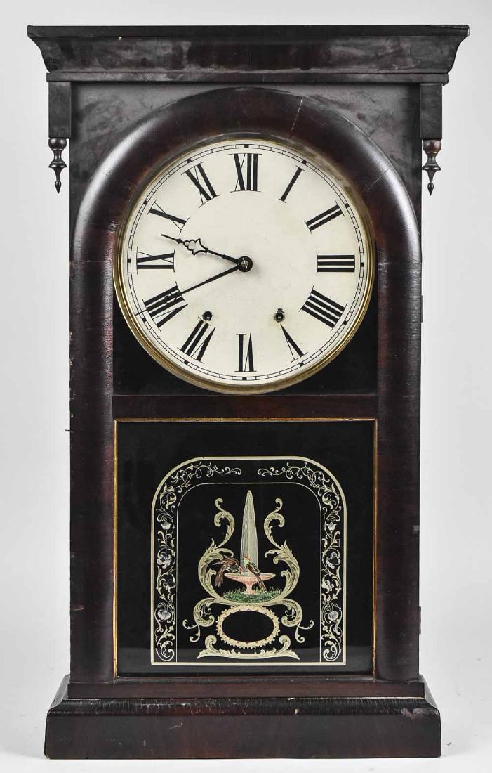 Wall Clock: Mahogany case, Roman numerals. Height 33 inches. Notice to bidders: Condition reports and additional photographs are provided by request as a courtesy to our clients, as such any condition report is o