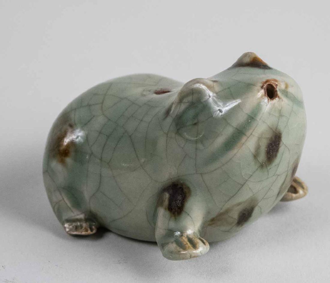 Korean Celadon Porcelain Water Dropper: Modeled as a seated frog. Notice to bidders: Condition reports and additional photographs are provided by request as a courtesy to our clients, as such any condition report is only an opinion and shou