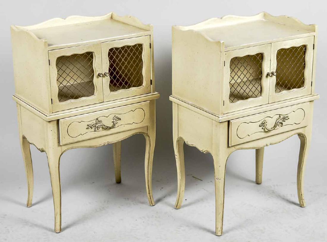 Pair of Louis XV Style Painted Nightstands: Each cream painted, rectangular top with three quarter gallery over two open grilled doors above a single drawer, cabriole legs. Height 30 inches, width 18 inches, depth 12 inches. Notice to bidders: 