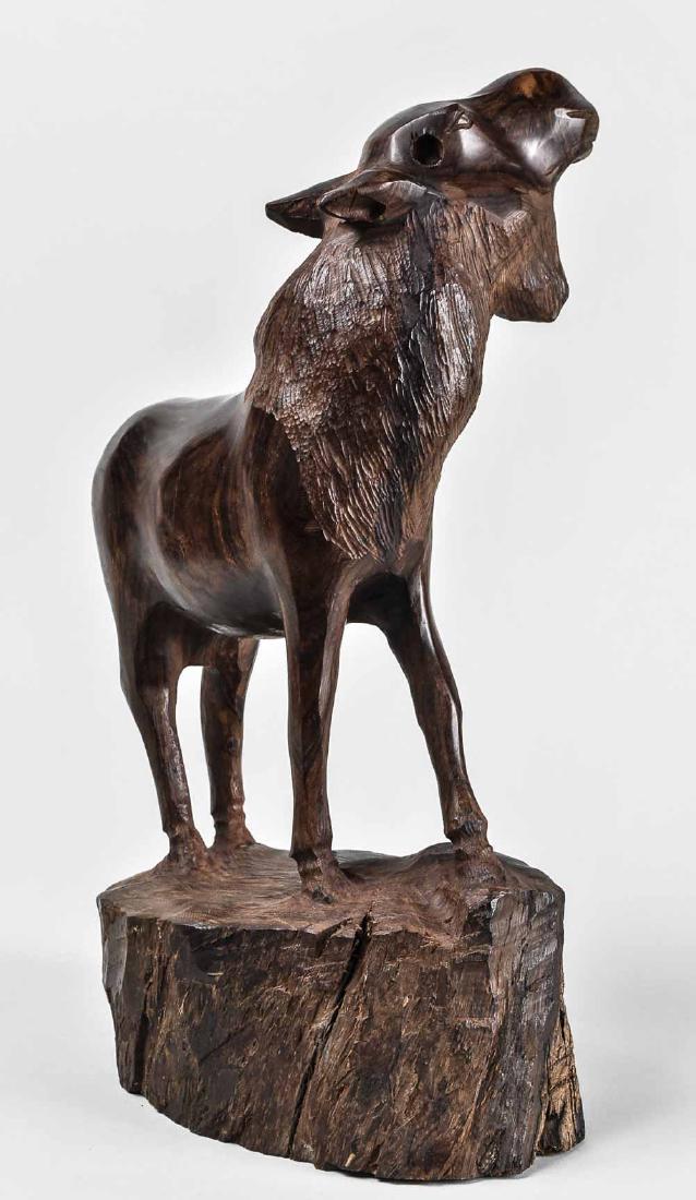 Carved Wood Moose Sculpture: Modeled standing with head raised (missing antlers). Height 16 1/2 inches. Notice to bidders: Condition reports and additional photographs are provided by request as a courtesy to our clients, as such