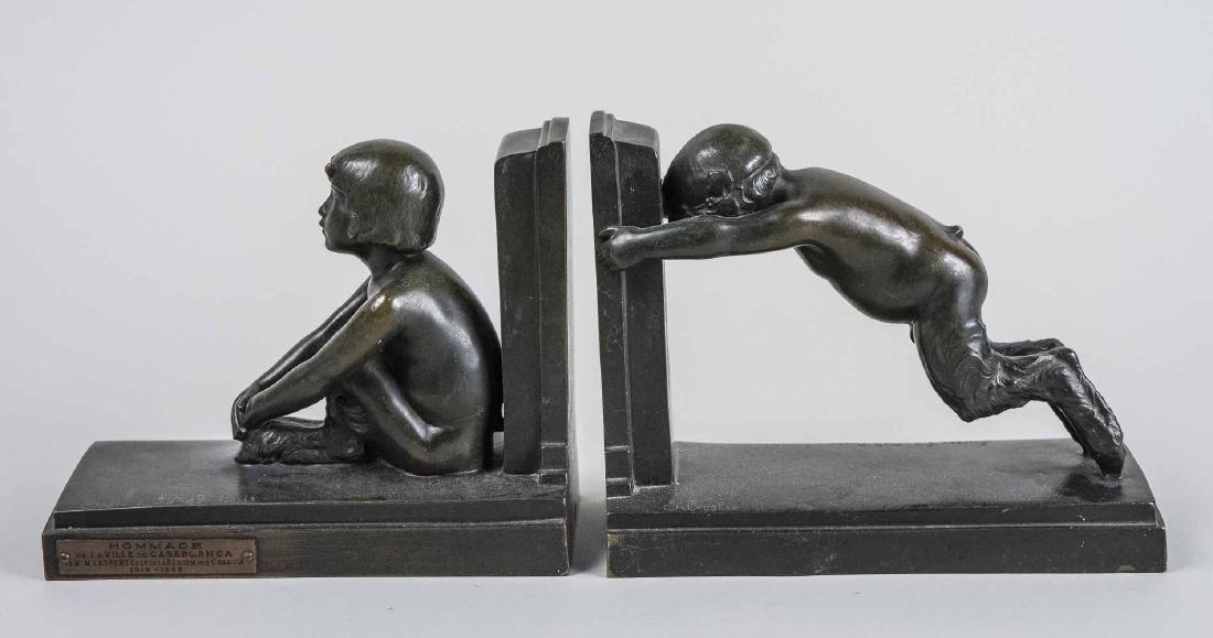 Paul Silvestre (French, 1884-1976): Pair of bronze bookends modeled as a boy and girl faun. Signed by Paul Silvestre and by the Susse Frere foundry. France, circa 1920. Height, 7 inches, width, 4 inches. length, 8 1/2 inches. Plaque mou