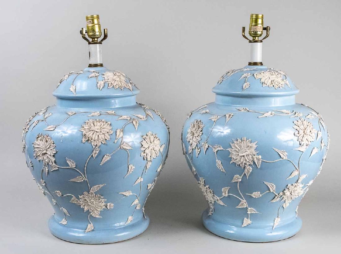 Pair of Wedgwood Style Porcelain Lamps: Light blue ginger jar shaped lamps with applied white floral decoration. Lamp, height 16 inches. Notice to bidders: Condition reports and additional photographs are provided by request as a courtesy t
