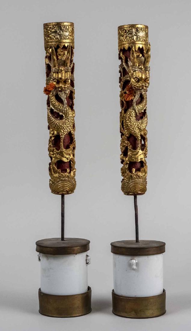 Pair of Indonesian Carved Gilt Candlesticks: Dragon decoration. Height 19 inches. Notice to bidders: Condition reports and additional photographs are provided by request as a courtesy to our clients, as such any condition report is only an opini