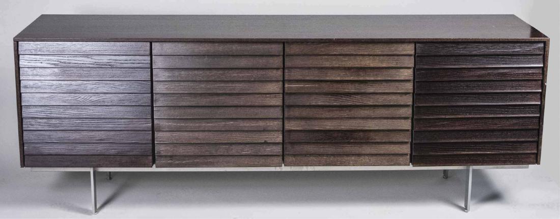 Modern Credenza: Rectangular top over four doors. Height 29 inches, width 80 inches, depth 19 inches. Notice to bidders: Condition reports and additional photographs are provided by request as a courtesy to our client