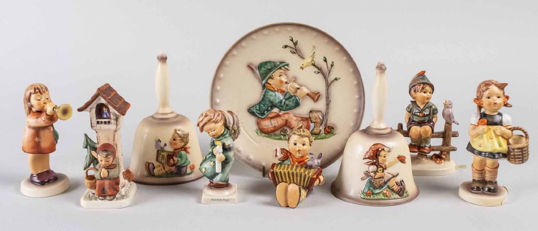 Group of Goebel Hummel Figures and Collectibles: Nineteen pieces, including two 1978 First Edition Annual Bells, four 1979 Second Edition Annual Bells, four 1979 Annual Plates/Plaques collectibles, and one of each of the Wayside Harmony, Apple Tree