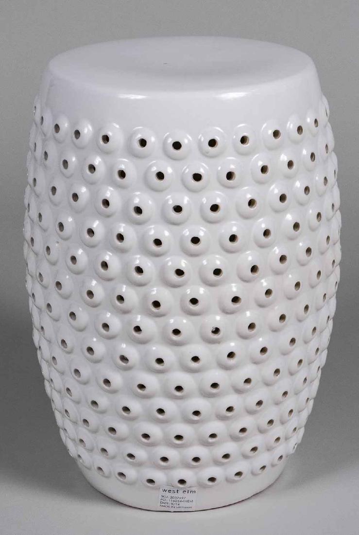 White Porcelain Garden Seat: Pierced decoration. Height 18 inches. Notice to bidders: Due to the nature of this particular online sale, the lots offered may not be available for detailed condition reports or additional photograph