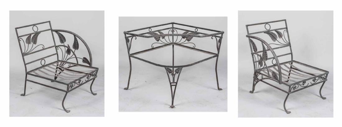 Green Metal Garden Furniture: Two chairs and a corner table with leaf and scroll decoration. Chairs, height 33 inches, width 24 inches , depth 30 inches. Notice to bidders: Due to the nature of this particular online sale, the lot