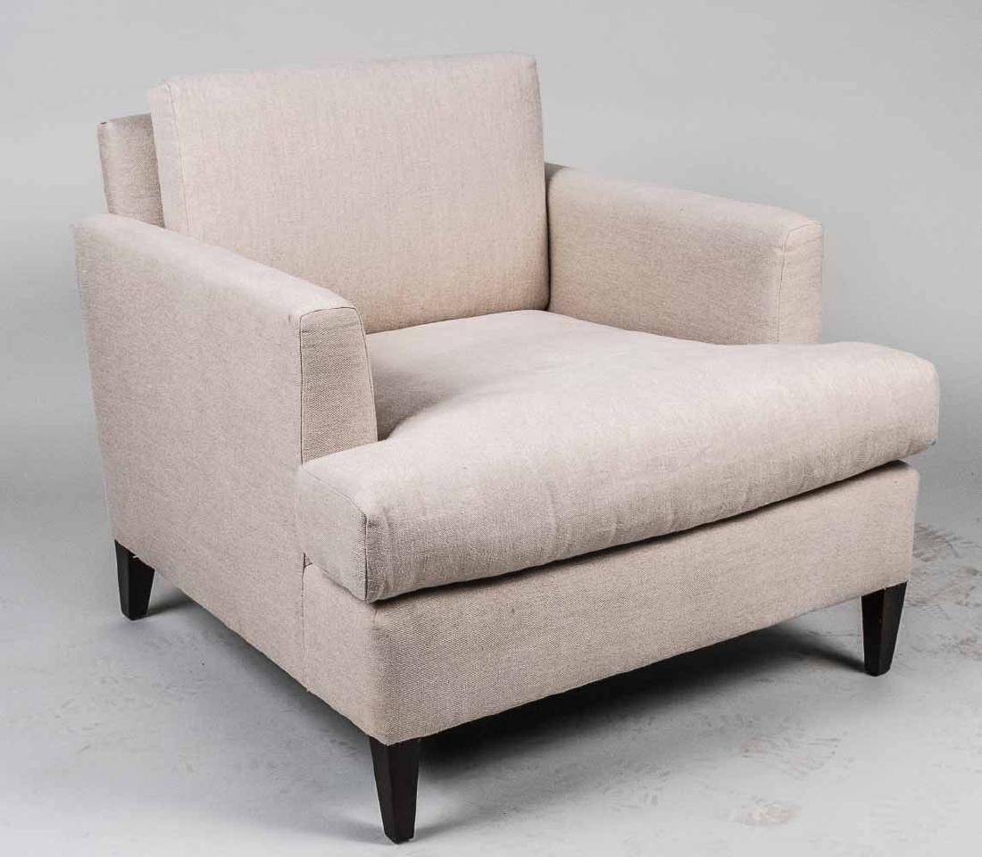 Attributed to Dunbar Mid Century Lounge Chair: In the manner of Edward Wormley, cream colored upholstery, cushion back and seat, on square tapered legs. Height 30 inches, width 33 inches, depth 35 inches. Notice to bidders: Due to the nature of th