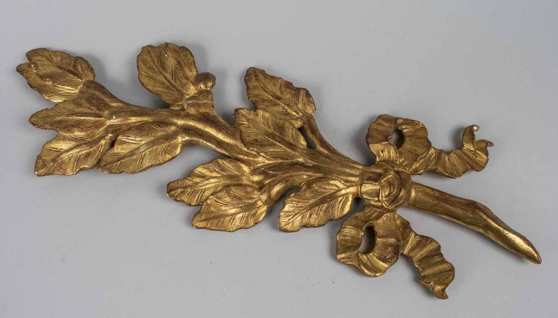 Gilt Wood Wall Applique: Ribbon tied branch with leaves. Height 27 inches. Notice to bidders: Due to the nature of this particular online sale, the lots offered may not be available for detailed condition reports or additiona