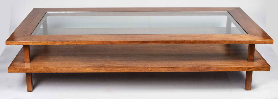 Glass Top Coffee Table: Rectangular glass inset wood top over a lower wood shelf, block legs. Height 18 inches, width 78 inches, depth 40 inches. Notice to bidders: Due to the nature of this particular online sale, the lots