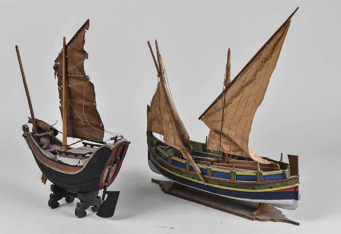 Two Model Sailing Ships: Two masted ships. Taller, height 15 inches. Notice to bidders: Condition reports and additional photographs are provided by request as a courtesy to our clients, as such any condition report is only a