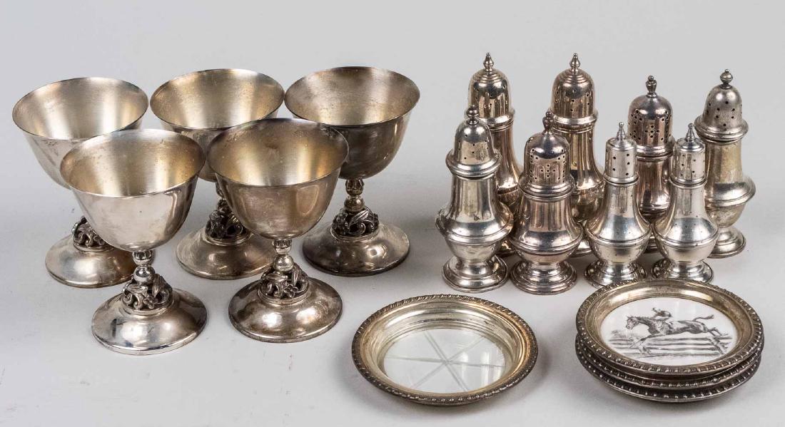 Group of Sterling Silver Table Articles *: Including five International sterling silver goblets in the style of Alphonse Lapaglia, together with a group of sterling silver shakers by various makers and sterling mounted coasters. Goblets, heigh